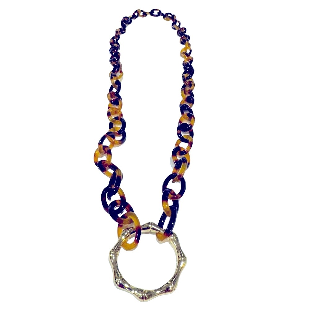 Fun and funky plastic tortoise link necklace with gold tone circle pendant. NWOT